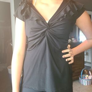 Very flattering black ruffled top.